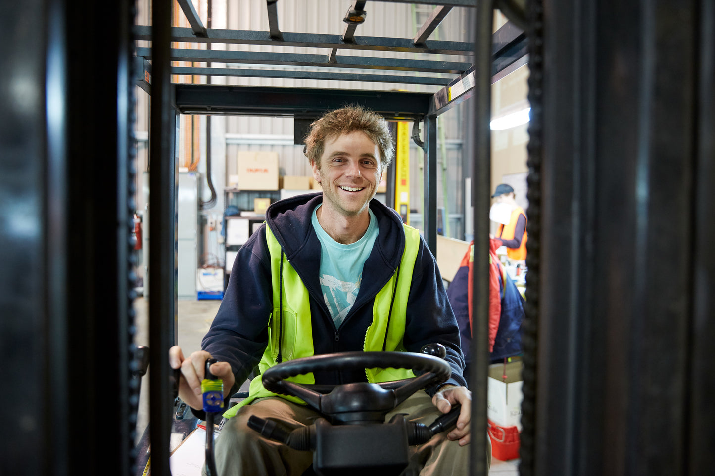 Koala Cherries Forklift Driver smiling whilst on the forklift